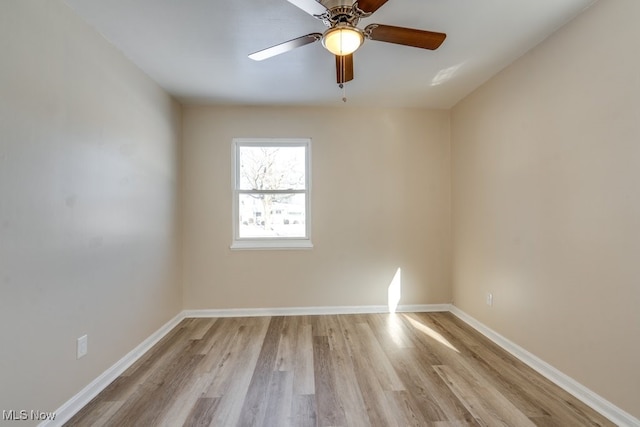 unfurnished room with ceiling fan and light wood-type flooring