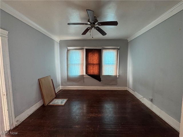 spare room featuring crown molding, dark hardwood / wood-style floors, and ceiling fan