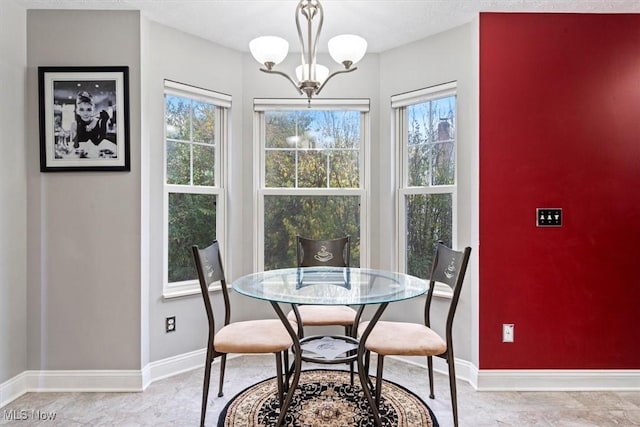 dining room with an inviting chandelier and a wealth of natural light