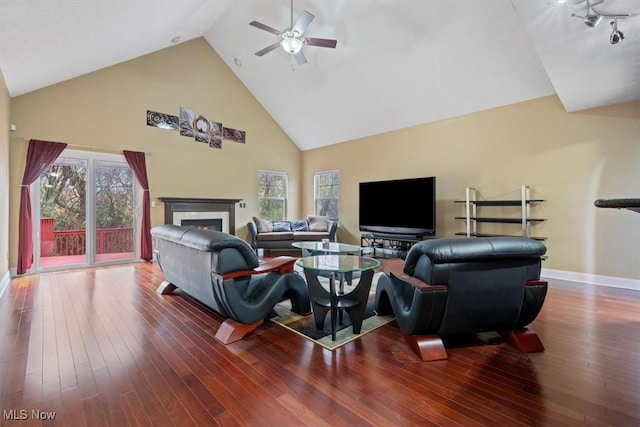 living room with high vaulted ceiling, hardwood / wood-style floors, and ceiling fan