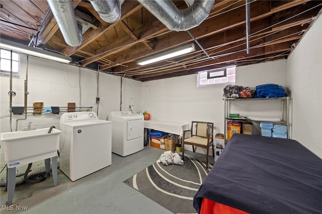 washroom featuring sink and independent washer and dryer