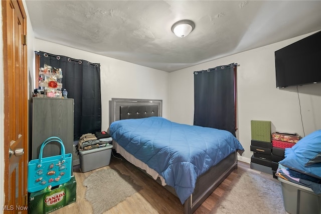 bedroom featuring hardwood / wood-style floors