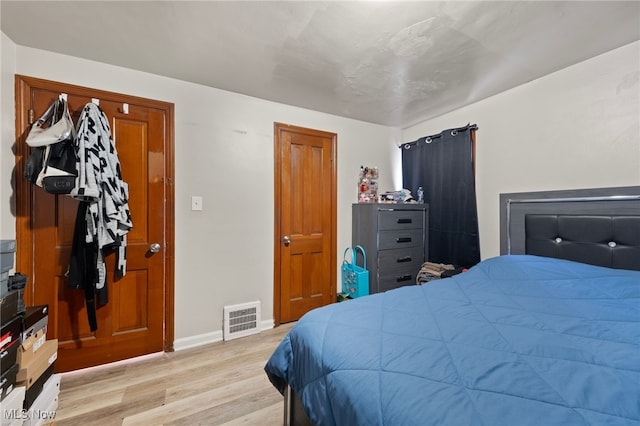 bedroom with light hardwood / wood-style floors