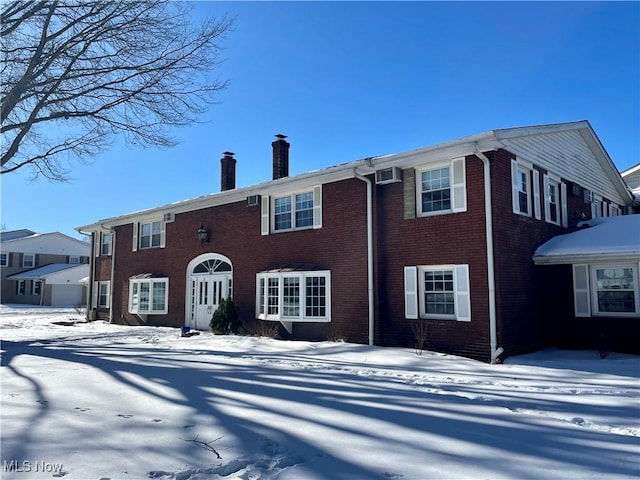 view of snow covered property