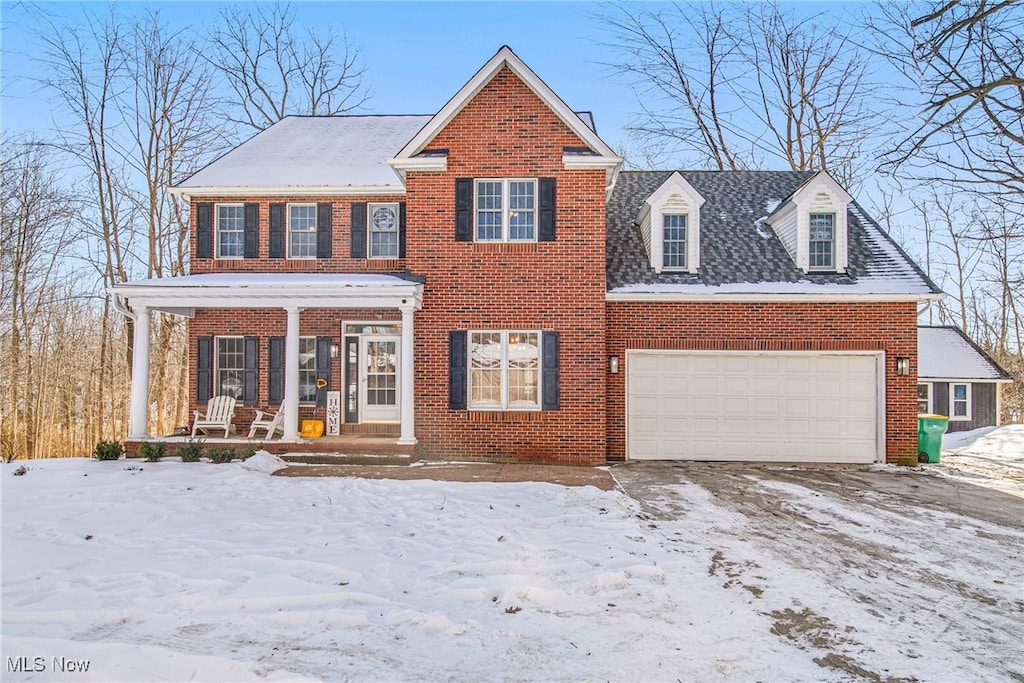 view of front of house featuring a garage and covered porch