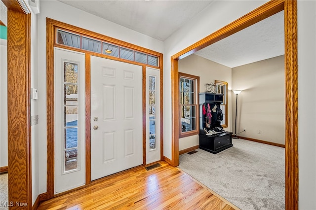 foyer with light hardwood / wood-style flooring