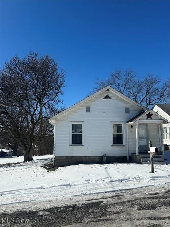 view of snow covered house