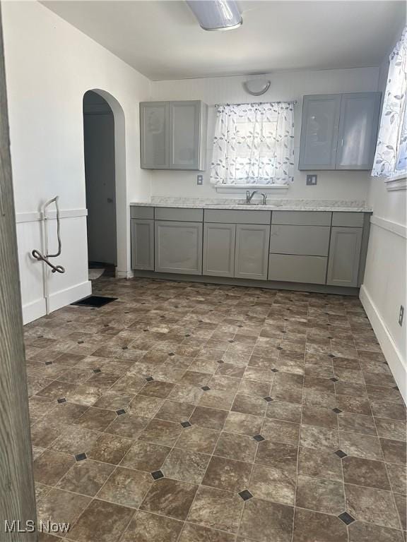 kitchen with gray cabinets and sink