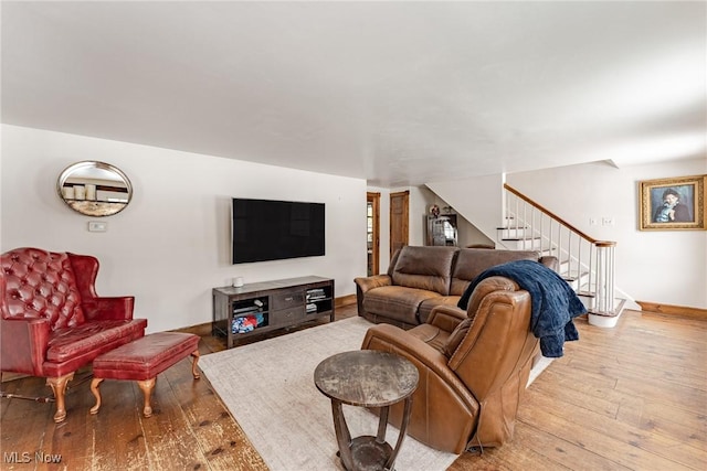 living room with light hardwood / wood-style flooring