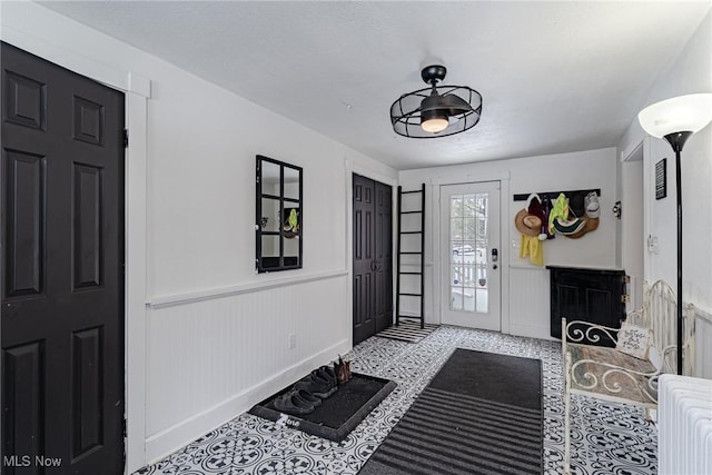 foyer with light tile patterned floors