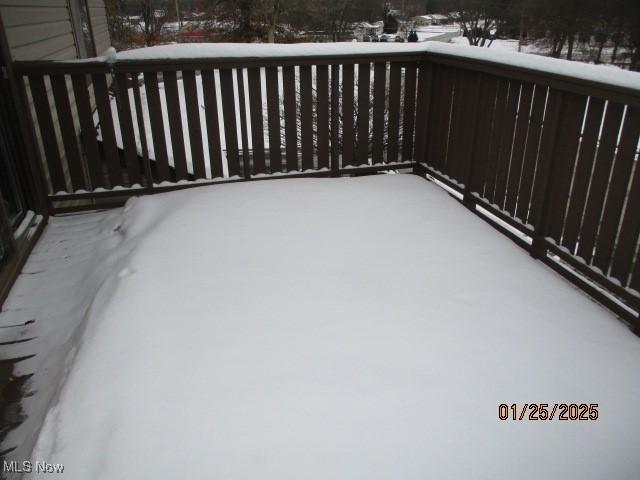 view of snow covered deck