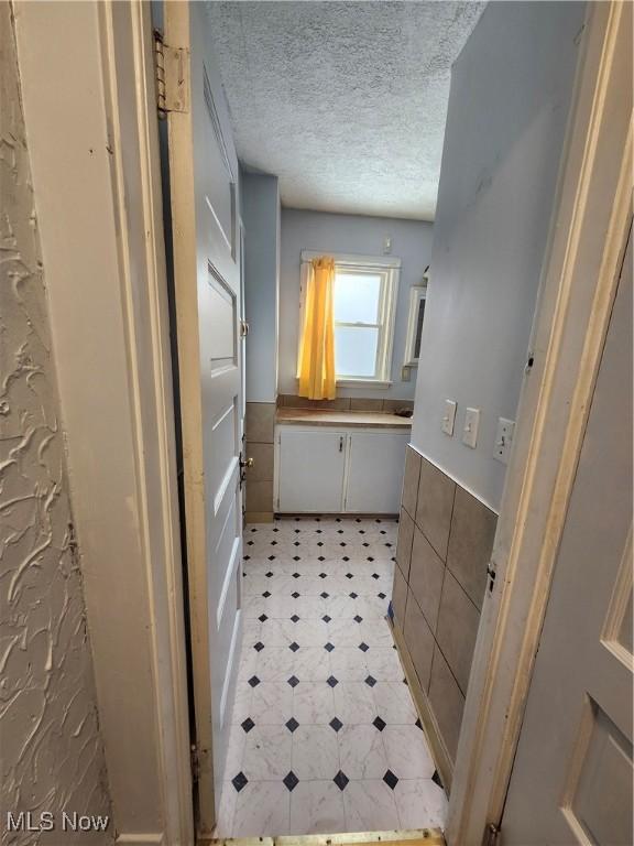 bathroom with a textured ceiling