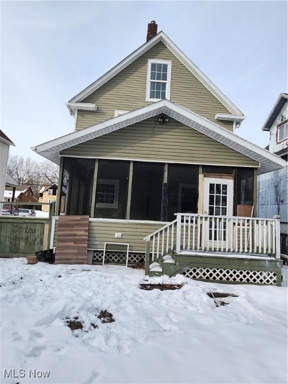 view of front of property with a sunroom