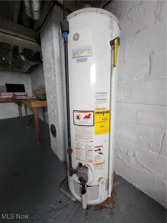 utility room with gas water heater