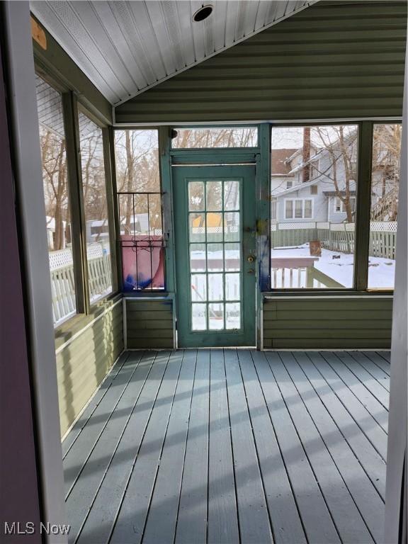 unfurnished sunroom with vaulted ceiling and wood ceiling