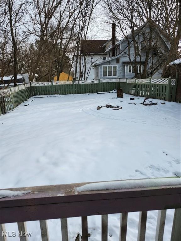 view of yard covered in snow