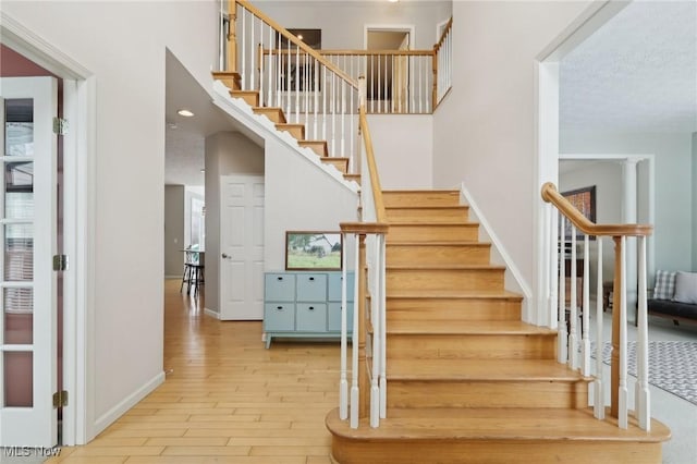 staircase featuring hardwood / wood-style floors