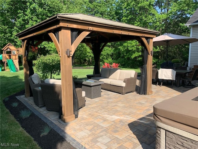 view of patio / terrace with an outdoor living space, a gazebo, and a playground