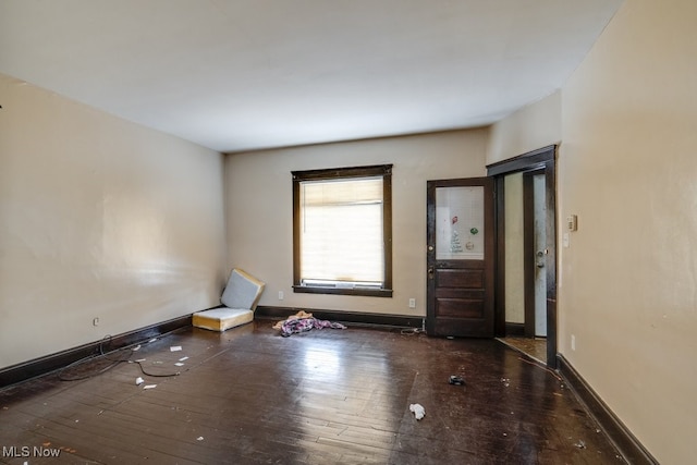 unfurnished room featuring dark hardwood / wood-style flooring