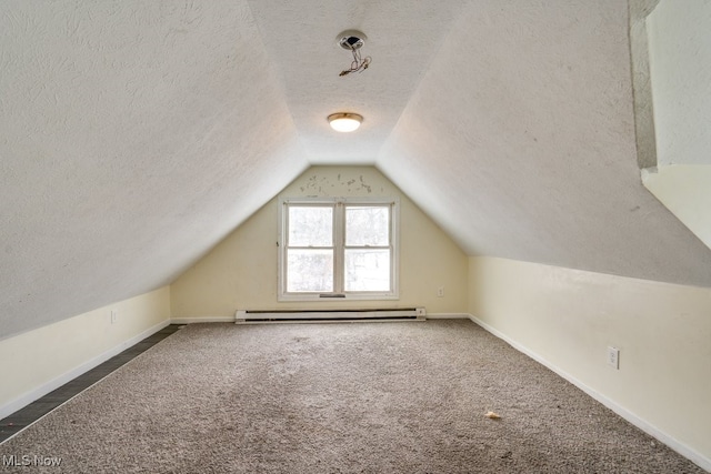 bonus room with dark colored carpet, lofted ceiling, a textured ceiling, and baseboard heating