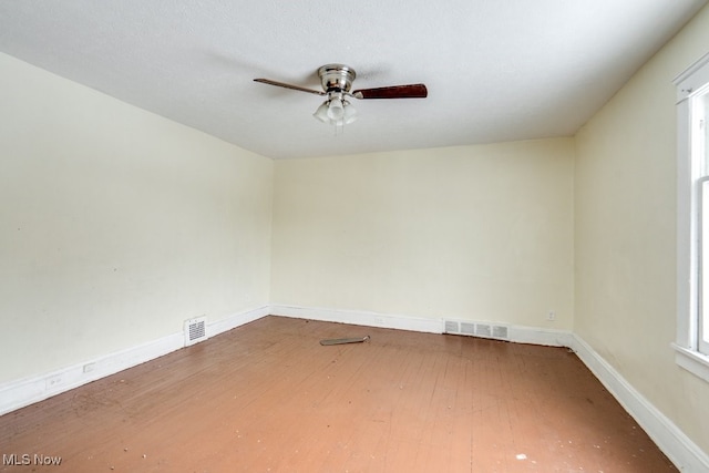 unfurnished room featuring ceiling fan and hardwood / wood-style floors