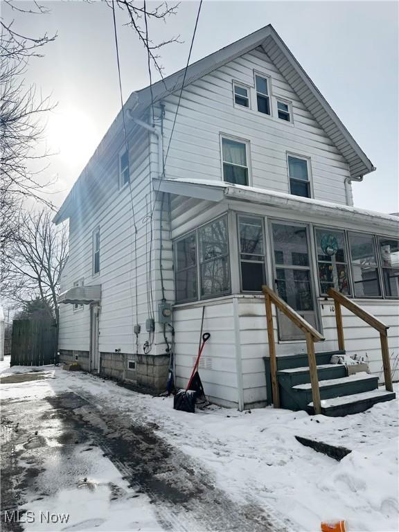 view of snow covered house