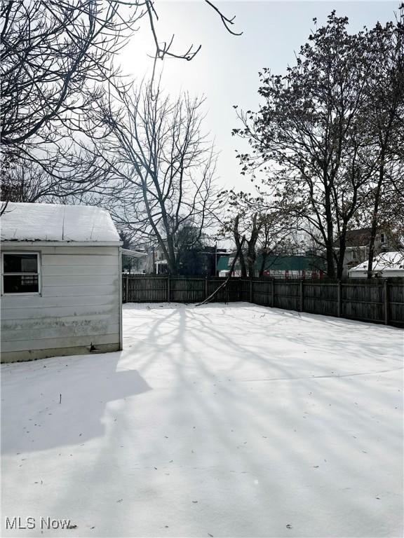 view of yard layered in snow