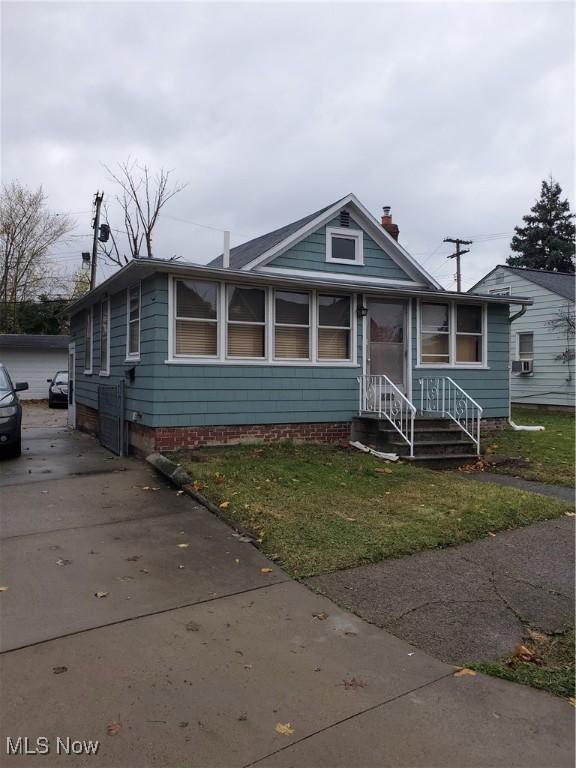 bungalow with a front yard