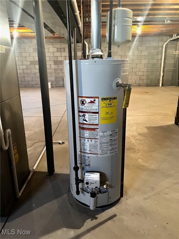 utility room featuring water heater