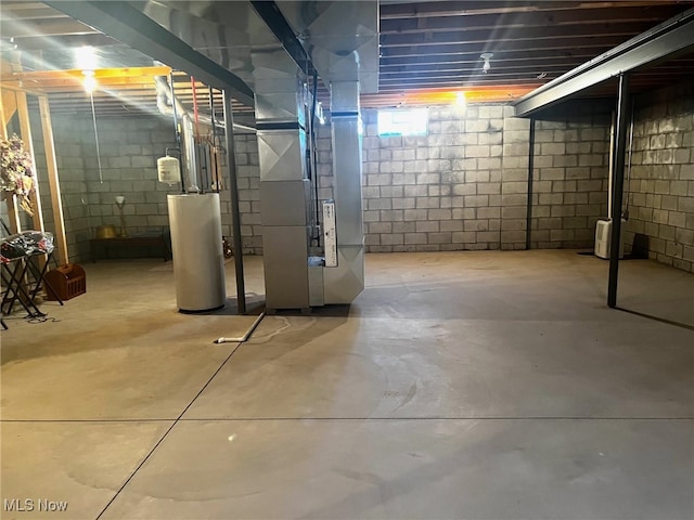 basement featuring heating unit and gas water heater