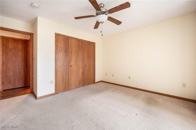 1089 Park Pl, Niles, OH 44446 - unfurnished bedroom featuring light carpet, a closet, and ceiling fan