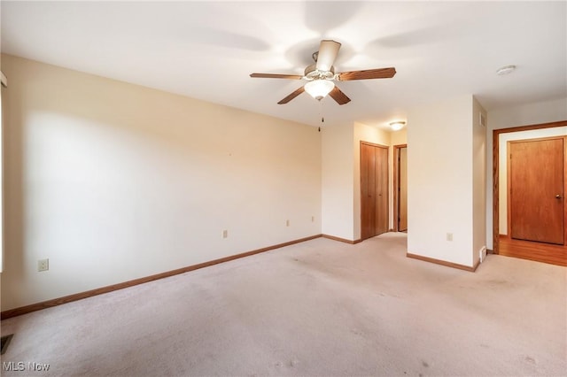1089 Park Pl, Niles, OH 44446 - unfurnished bedroom with light colored carpet, ceiling fan, and a closet