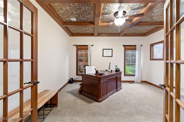 office space with ceiling fan, coffered ceiling, carpet floors, ornamental molding, and french doors