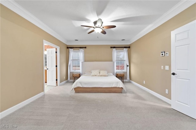 bedroom featuring crown molding, light colored carpet, and ceiling fan