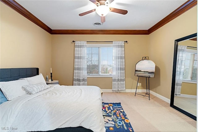 carpeted bedroom featuring ceiling fan and ornamental molding