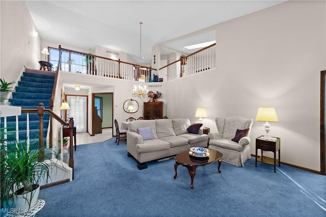 carpeted living room with a high ceiling