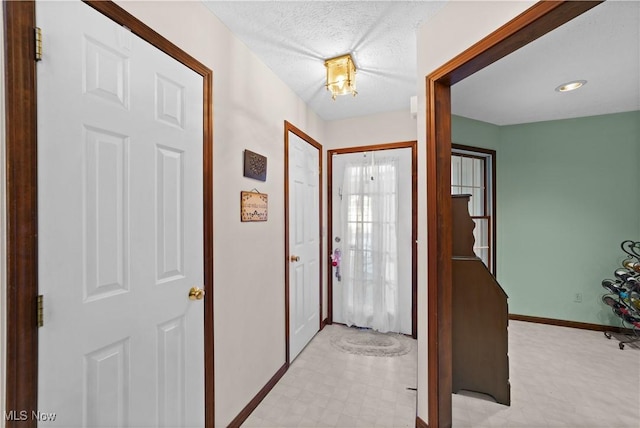 entrance foyer with a textured ceiling