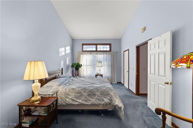 carpeted bedroom featuring high vaulted ceiling