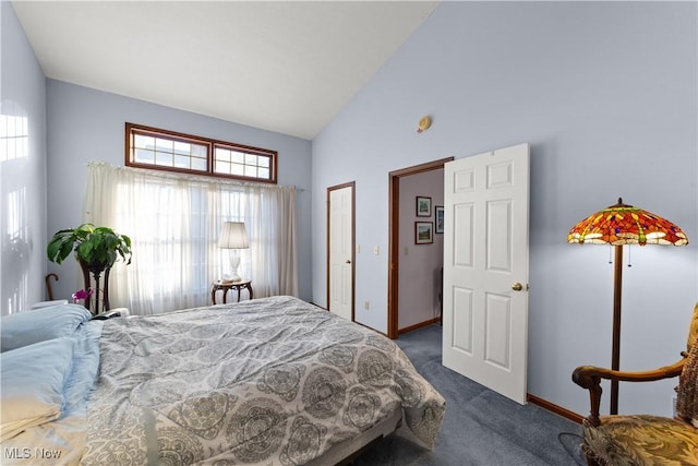 carpeted bedroom featuring high vaulted ceiling