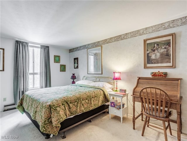 bedroom featuring a baseboard radiator and carpet