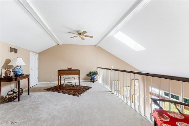 bonus room featuring lofted ceiling with skylight, light carpet, and ceiling fan