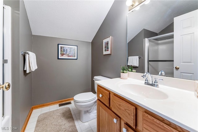 bathroom with vaulted ceiling, a shower with shower door, vanity, and toilet