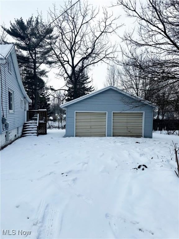 view of snow covered garage