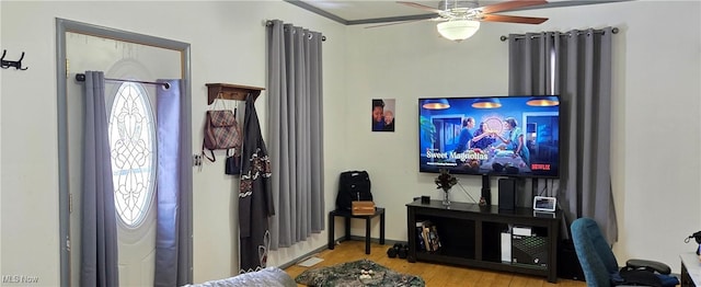 living room with ceiling fan, light hardwood / wood-style flooring, and a wealth of natural light