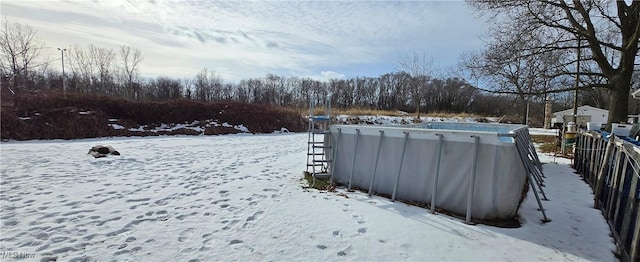 view of yard layered in snow