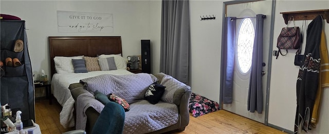 bedroom with hardwood / wood-style floors