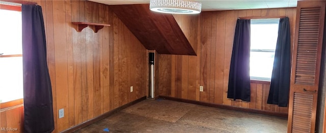 bonus room with wood walls