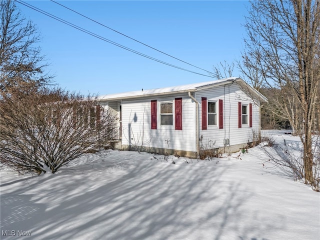 view of snow covered property