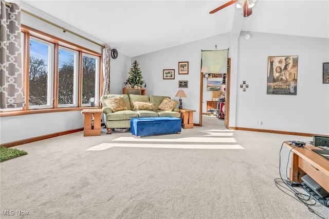 carpeted living room featuring lofted ceiling with beams and ceiling fan