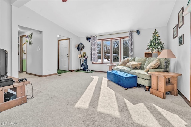 living room with carpet floors and vaulted ceiling